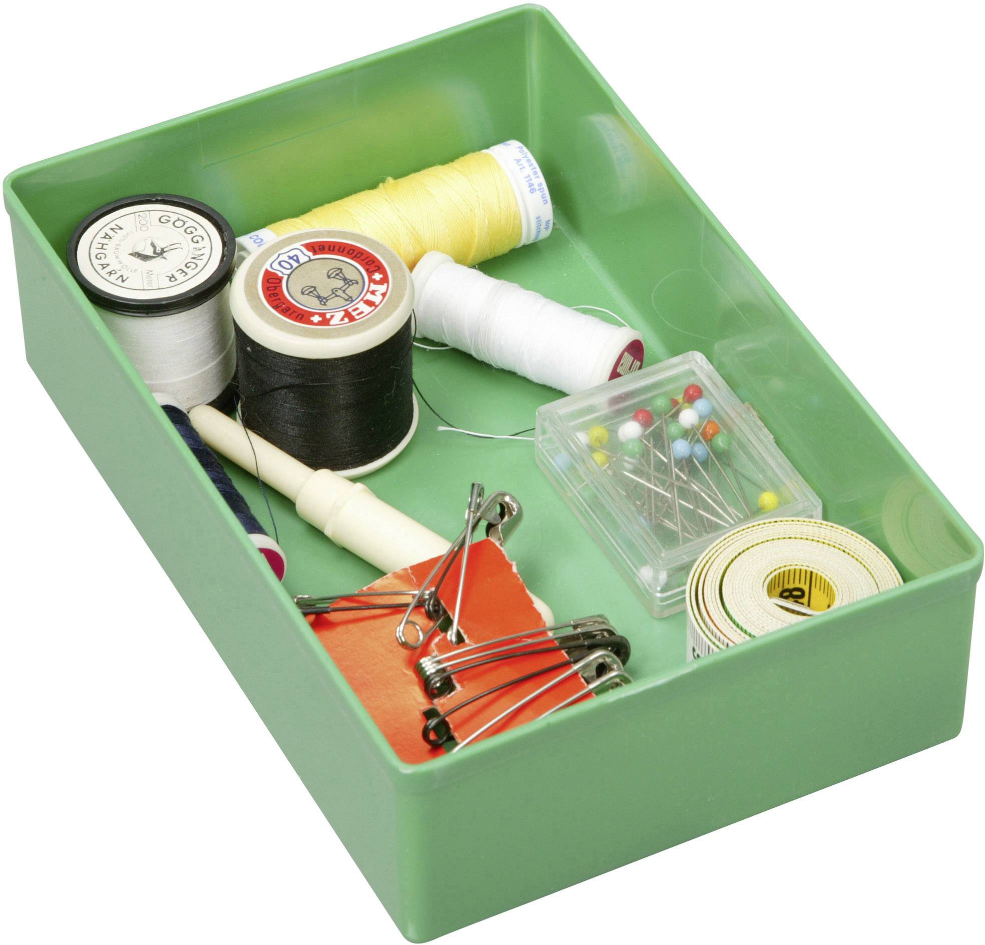 Sewing box with cotton reels, pins, tape measure, safety pins, and a seam ripper.