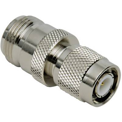 A silver metal adapter, possibly a coaxial plug, with knurled and smooth sections, lies on a white background.
