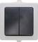A double light switch with a black plastic cover and white mounting frame.