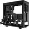Black computer case without casing, reveals open internal structure with hard drive bays and fan mounting points. Ideal for PC build projects.