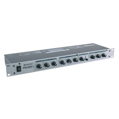 A silver audio device with multiple controls and switches on the front panel, likely a mixing amplifier for professional audio applications.