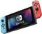 A Nintendo Switch with detachable Joy-Con controllers in blue and red.