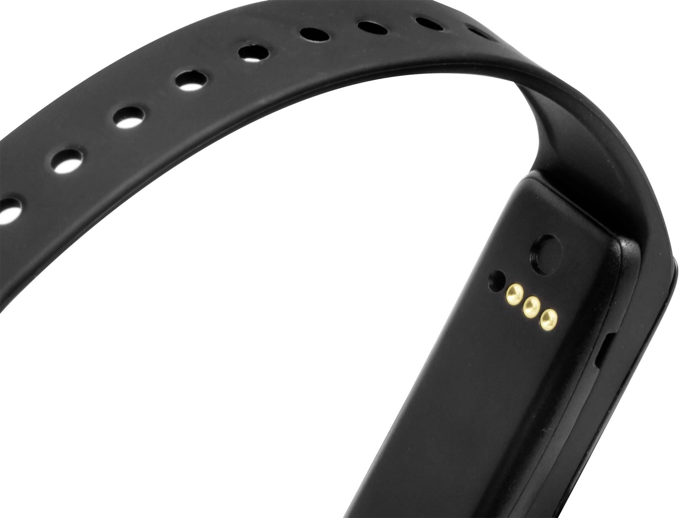A black fitness band with charging port and adjustable strap. It is pictured near the closure buckle.
