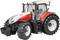 A red tractor with large tyres and a white roof stands on a neutral background.
