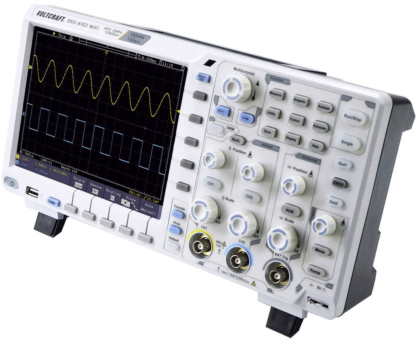 Digital oscilloscope with yellow and blue waveform display. Device buttons and connections are visible. Used for signal analysis.
