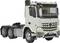 A white lorry from a well-known manufacturer. It is a tractor unit with six wheels, suitable for heavy loads.