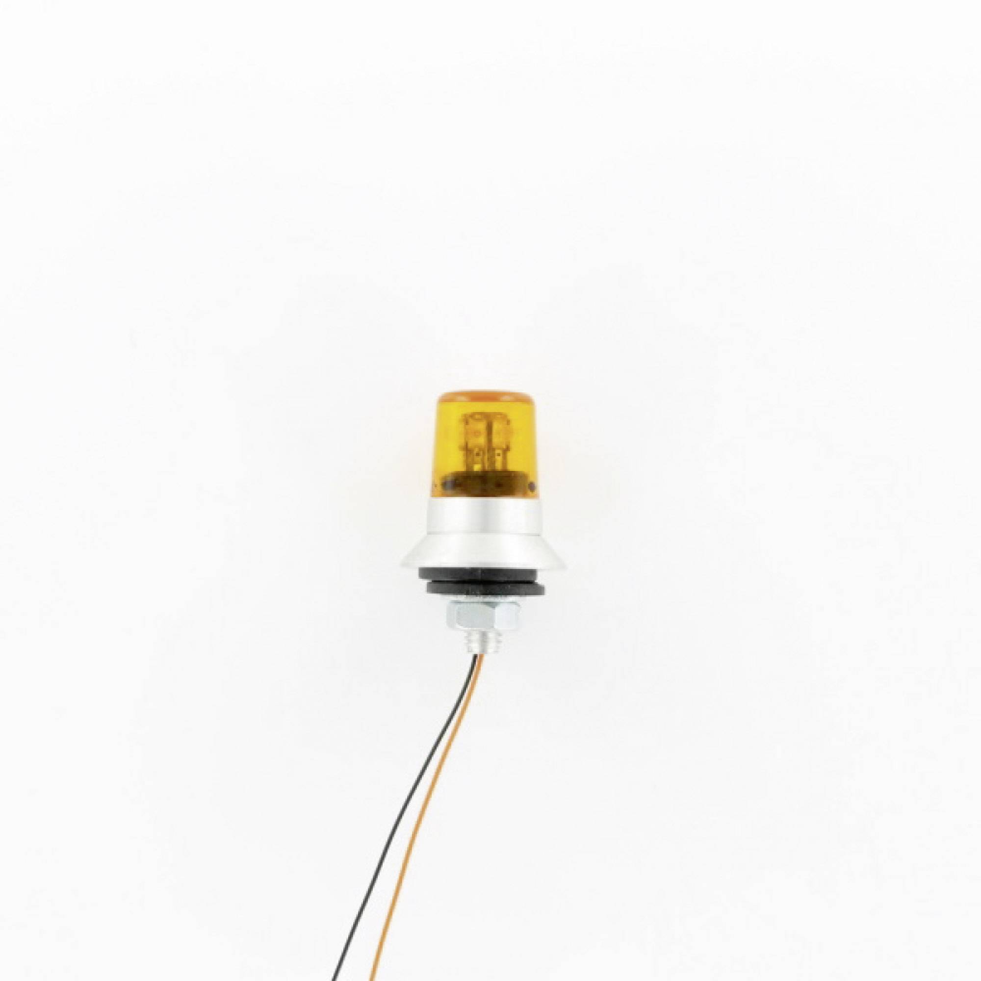 An orange warning light with two cables protrudes from the underside.