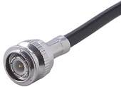 A coaxial cable with a BNC connector, commonly used in video and network applications, shows the metallic plug at the end of the cable.