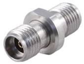 A metal adaptor with two threaded ends. Used for connecting pipes or hoses in technical applications.