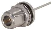 Coaxial plug with metal housing, threaded connection, and long cable. Suitable for connecting high-frequency signals in electronic devices.