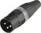 A black three-pin XLR socket used for audio connections in professional sound and studio applications.