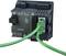 An industrial module with multiple ports and green Ethernet cables, suitable for Profinet communication in industrial networks.