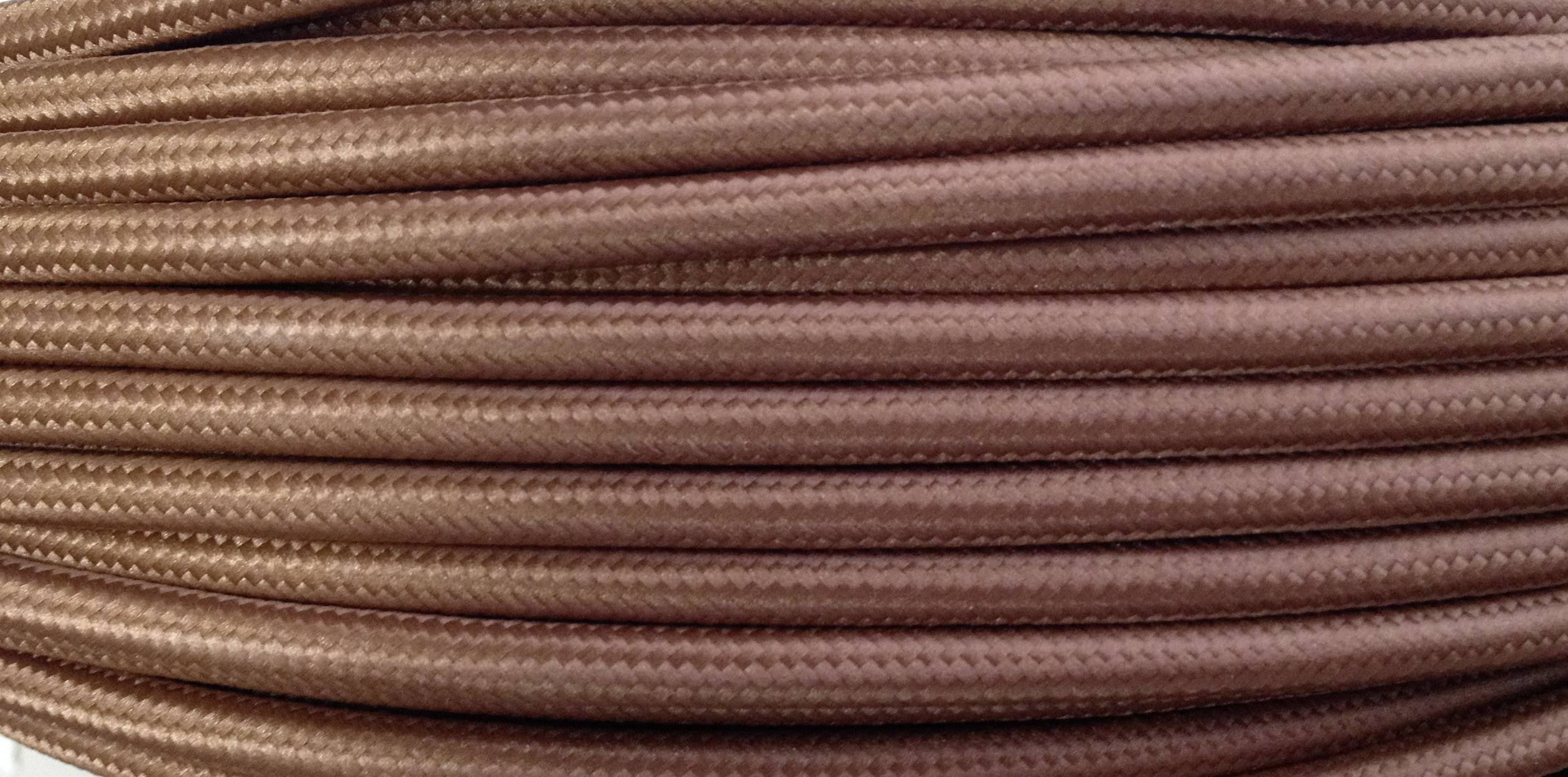 Close-up of brown braided cables, running neatly and parallel. Ideal for electrical or decorative purposes.