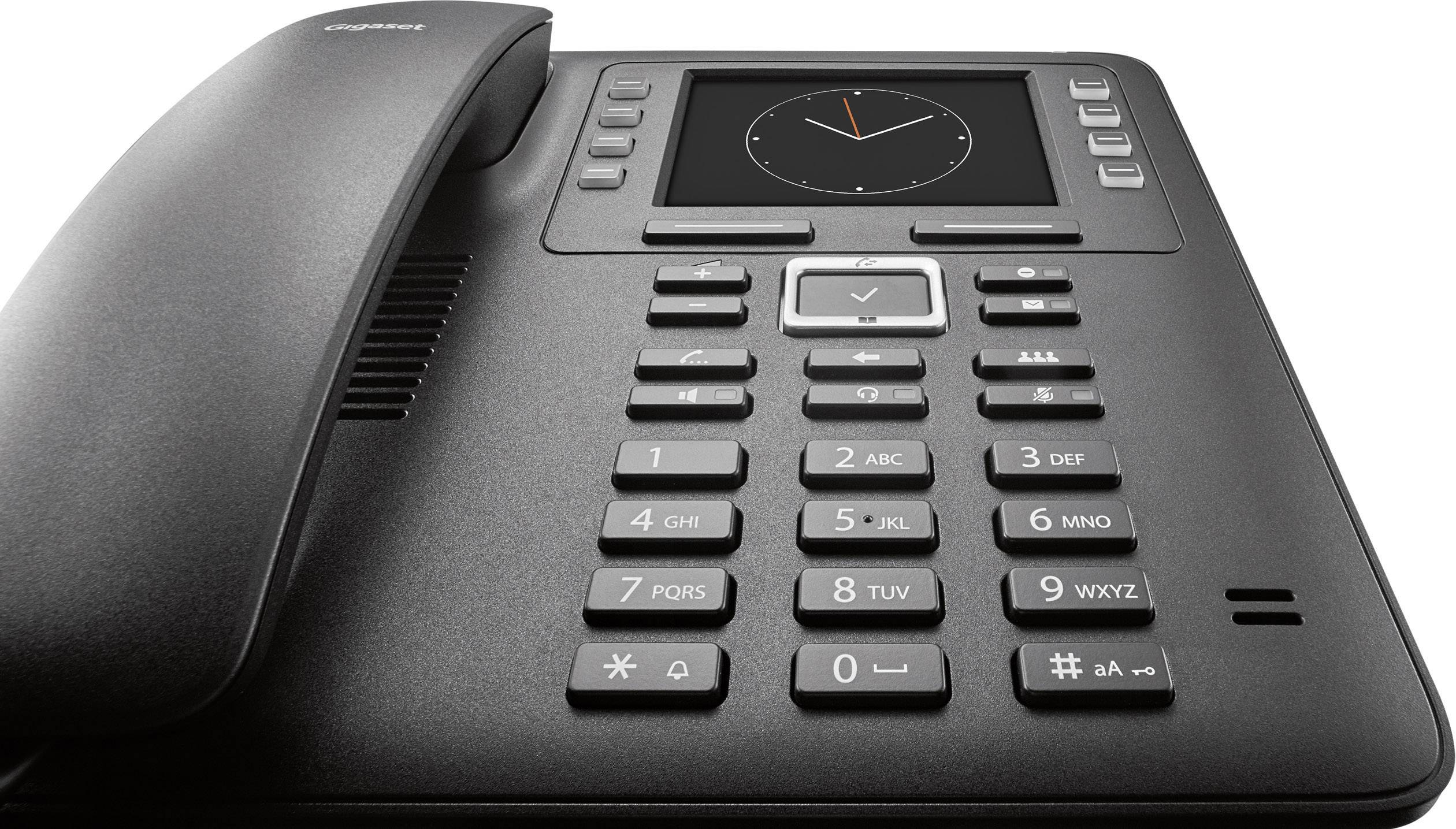 A black office telephone with a digital display and numerical keypad. An analogue clock is displayed on the screen.