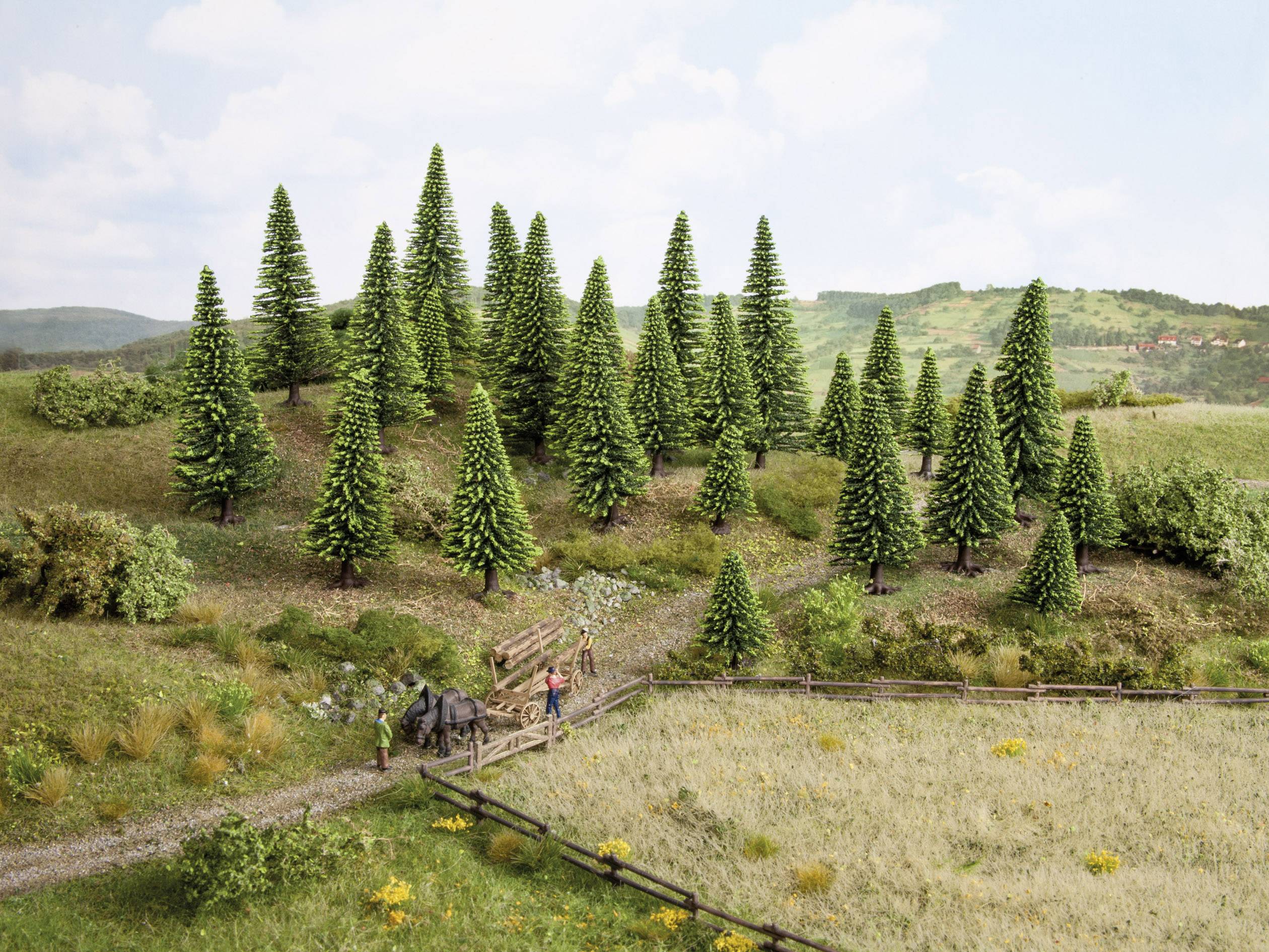 A miniature landscape with hills and conifer trees. A small path leads through a gate. Figures can be seen in the foreground.