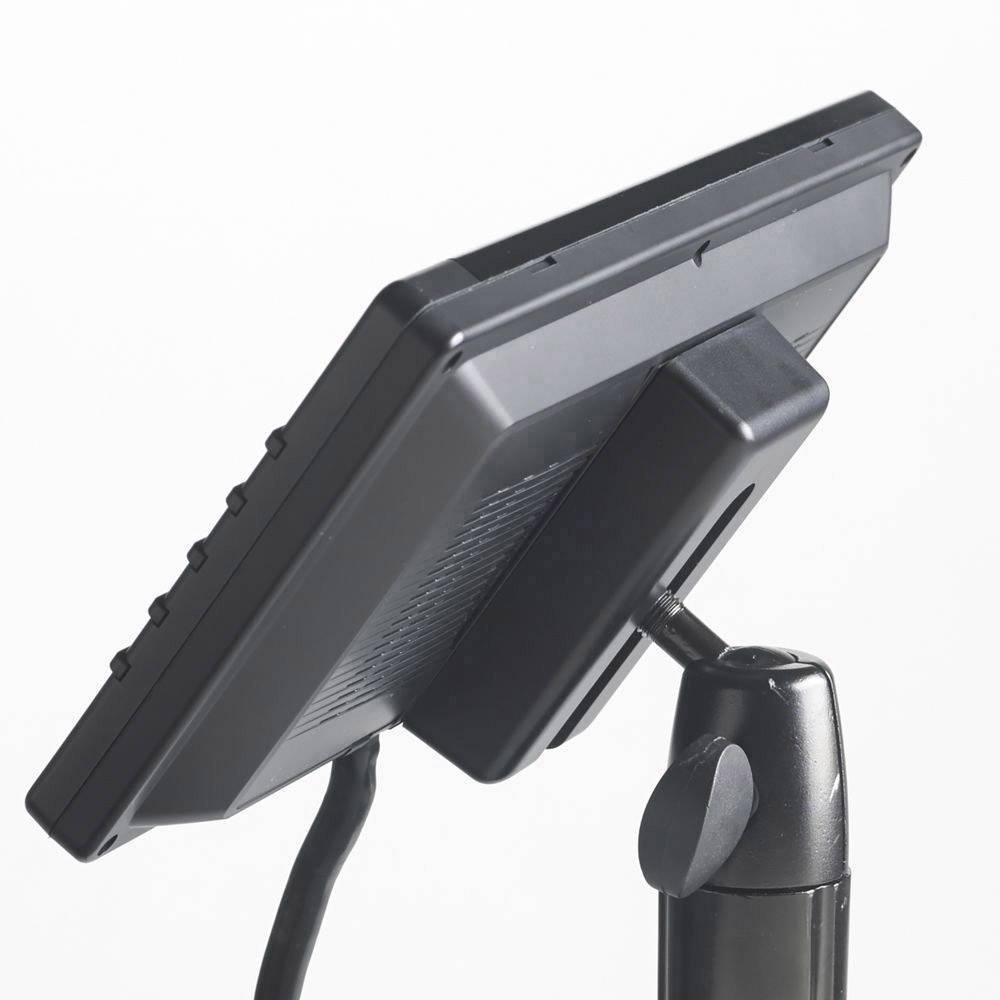 A black monitor is mounted on a flexible stand, angled to the left.