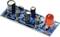 Electronic circuit on a blue circuit board with multiple capacitors, resistors, and a large red LED.