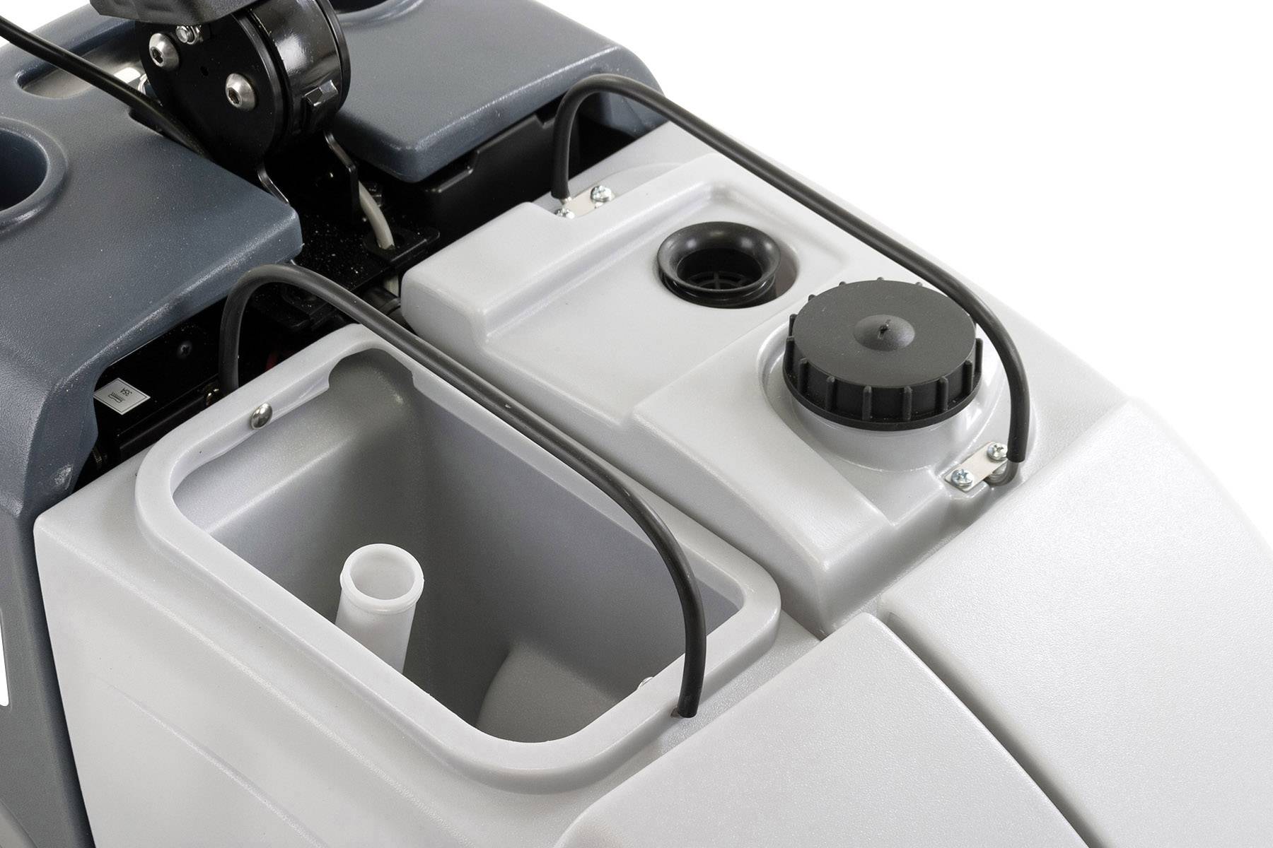 A cleaning device with an open cover reveals various tanks and a cable. It is used for floor care.