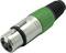 An XLR cable plug with a green housing, typical for audio device connections, shows three metal contacts for signal transmission.