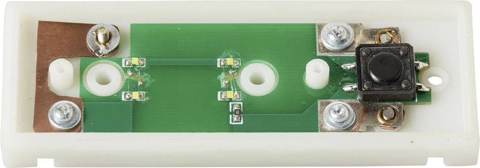 A green printed circuit board with a black push button and several mounting elements on a white plastic mounting bracket.