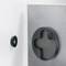 Magnetic catch with adjustable counterpart for furniture; circular, black, mounted on a grey surface.