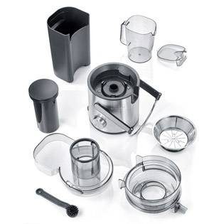 A disassembled juicer with various parts including a motor block, juice container, pressing cone, sieve, and cleaning brush.