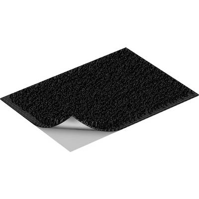 A black floor mat with a textured surface, slightly folded up at one corner, reveals a white underside.