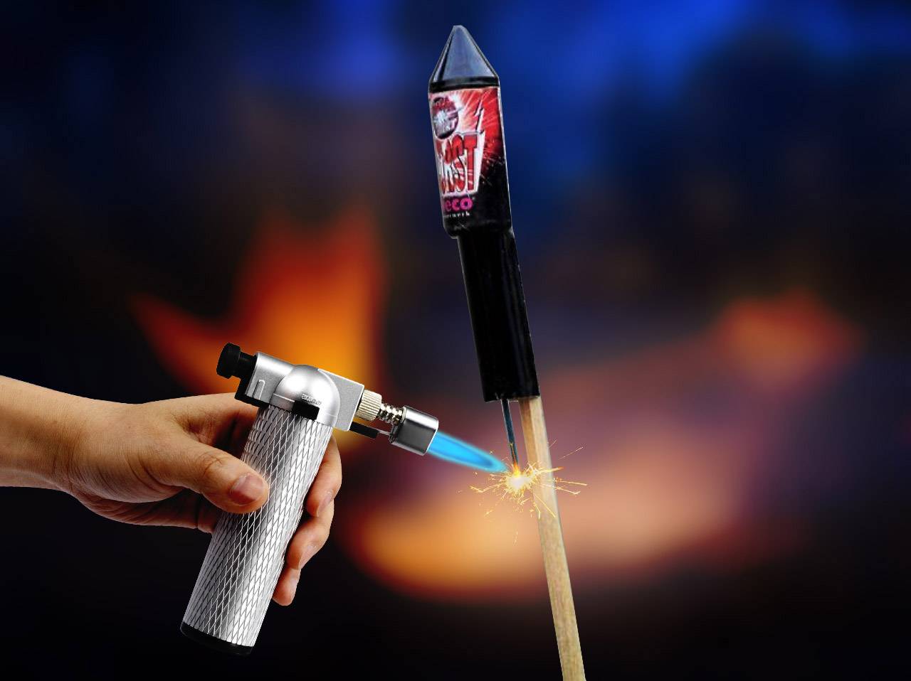 A person ignites a rocket fixed to a wooden stick using a lighter-like device. Sparks fly.