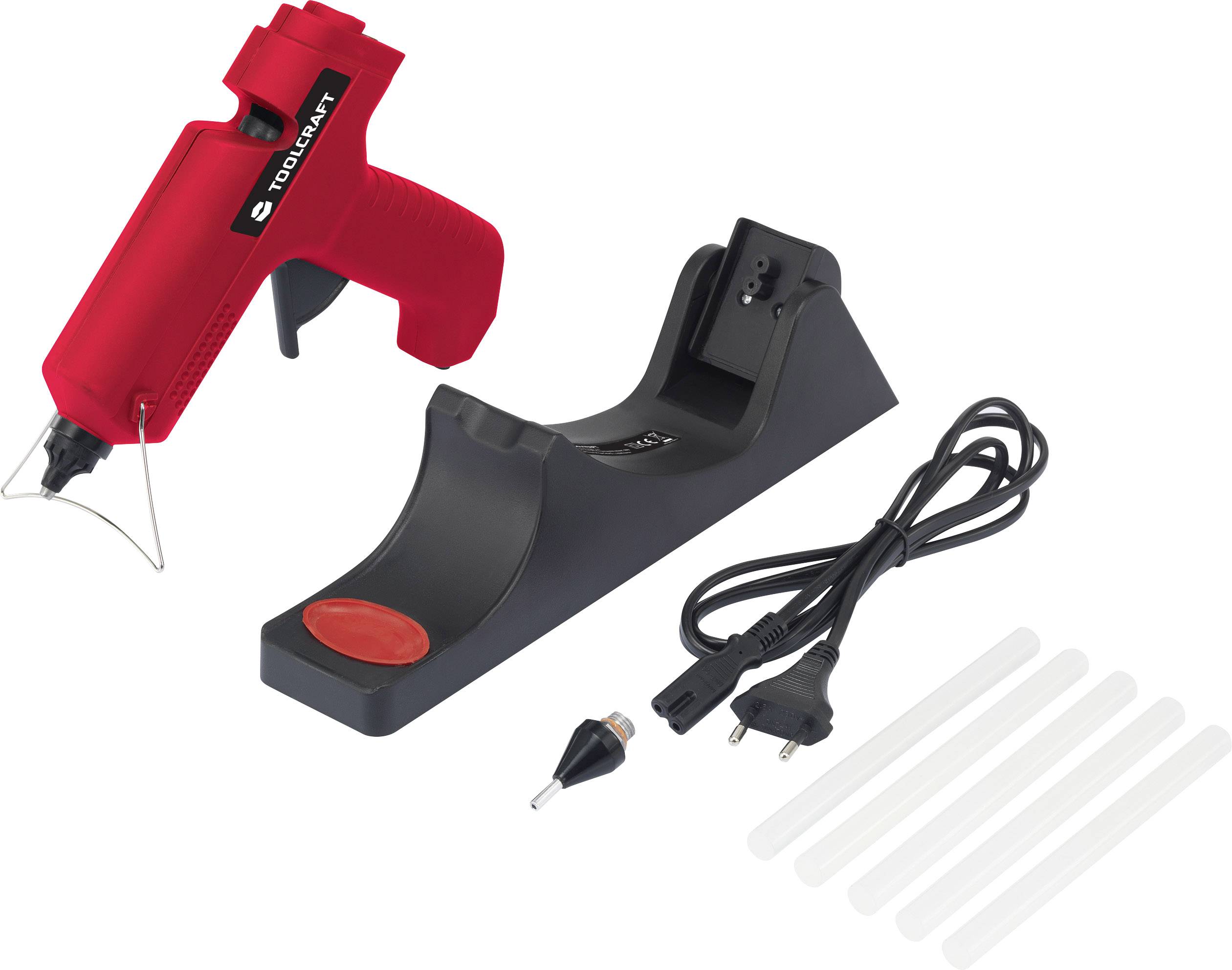 Hot glue gun with red handle, black charging station, power cable and six glue sticks.