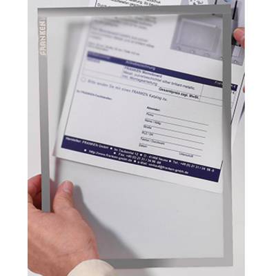 A person is holding a transparent desk mat with a printed form underneath. The form displays address fields and text.