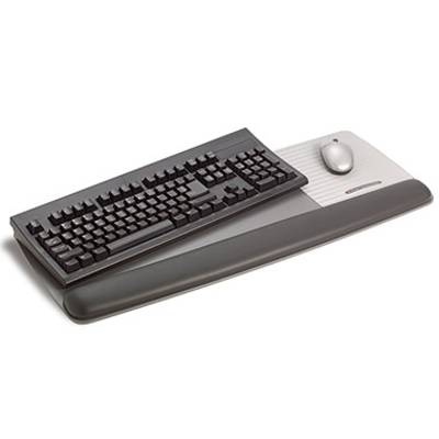 Black computer keyboard with a grey wrist rest and integrated mouse on the right-hand side.