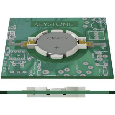 A green printed circuit board with a mounted CR2032 button battery. At the top, the text 'KEYSTONE'; surrounded by several electronic connectors.