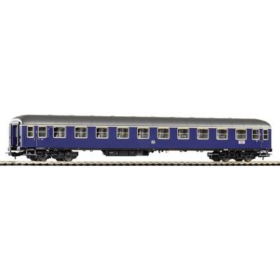 Blue train carriage on the track, side view. Contains numerous windows and a silver roof covering.