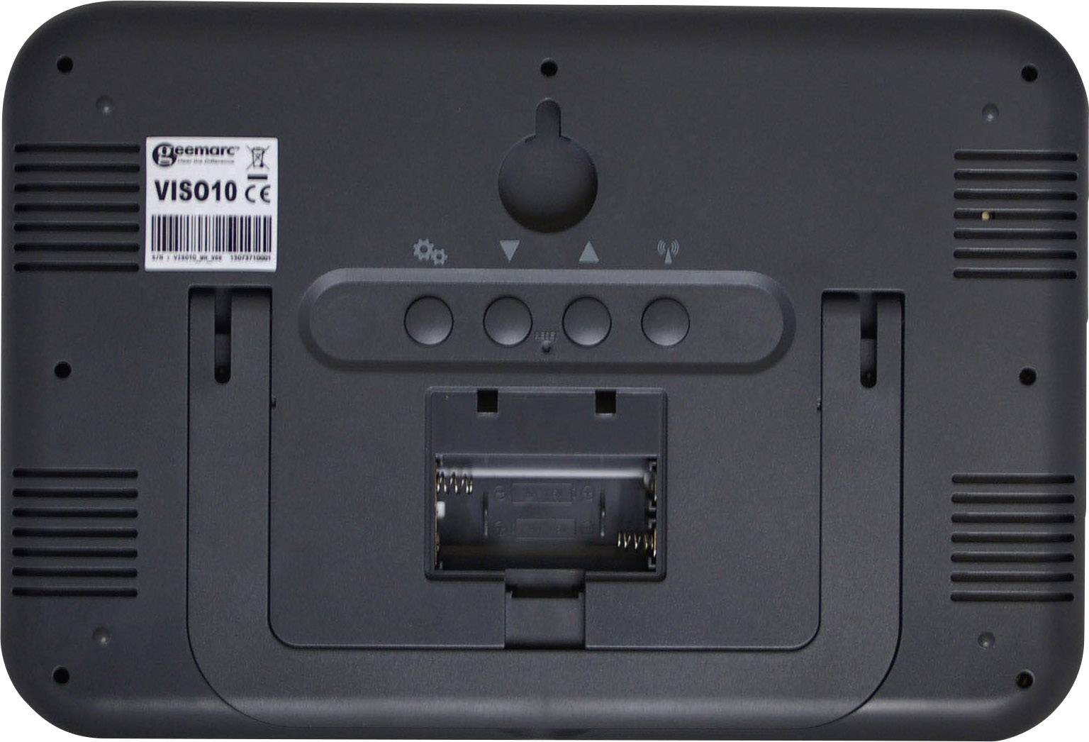 The back of an electronic device with a battery compartment and four round buttons. A label with the model number is located in the top left.