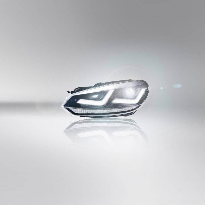 A modern car headlight module on a light background. It displays LED lights with a stylish, sleek design.