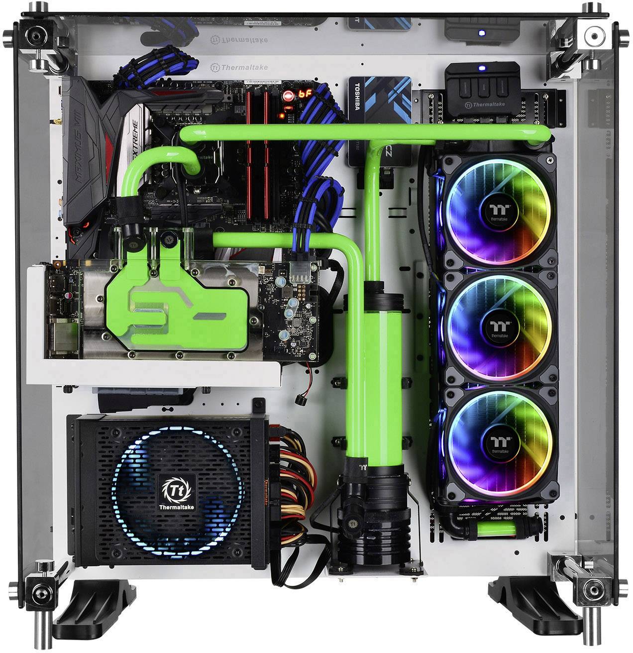 An open computer with green liquid cooling and three vertically arranged fans with colourful lights inside.