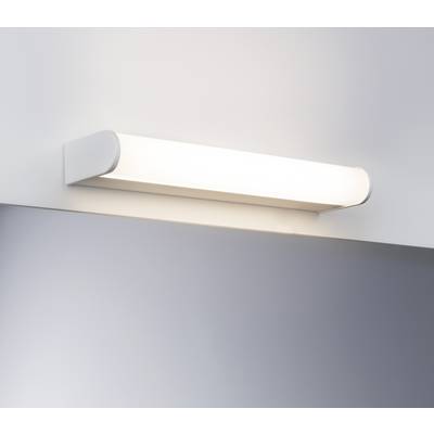 White wall light with a modern, elongated shape that emits soft, even light onto the wall and surrounding area.