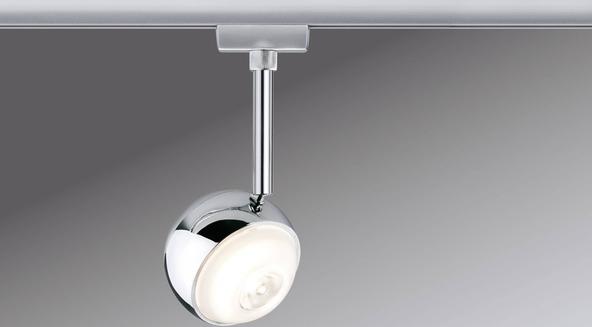 Modern ceiling light with metallic, rotatable spotlight. Simple design, adjustable orientation, suitable for focused lighting.