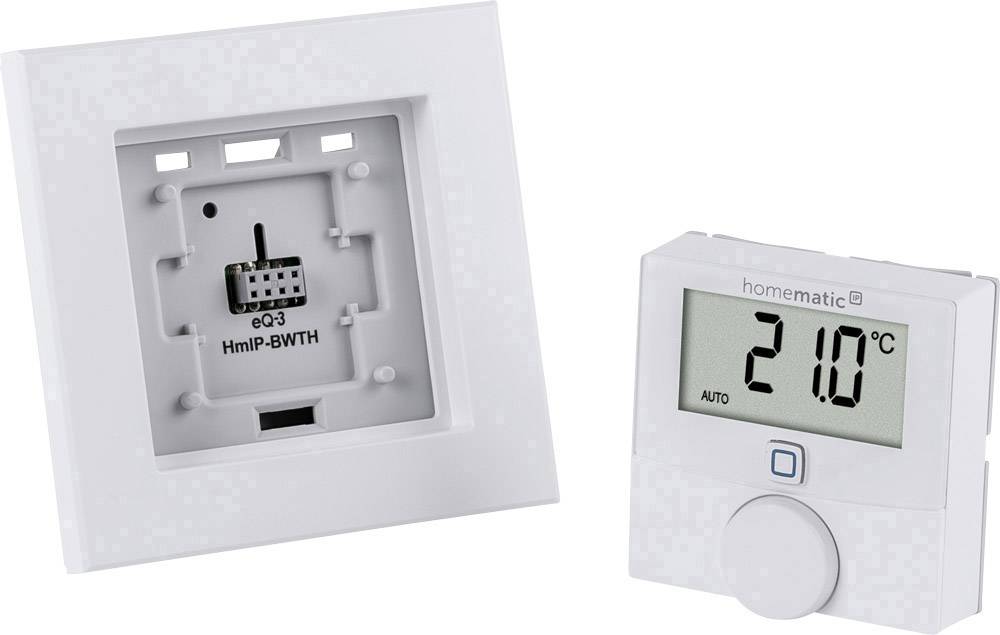 Two parts of a heating thermostat: On the left, a wall plate for installation, on the right a display showing '21.0°C', with a rotary control beneath it.