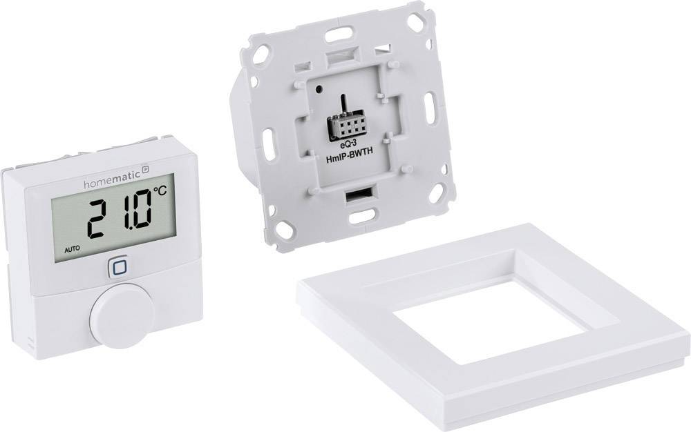 Room thermostat with digital display showing 21.0 °C. Includes a wall module and a frame.