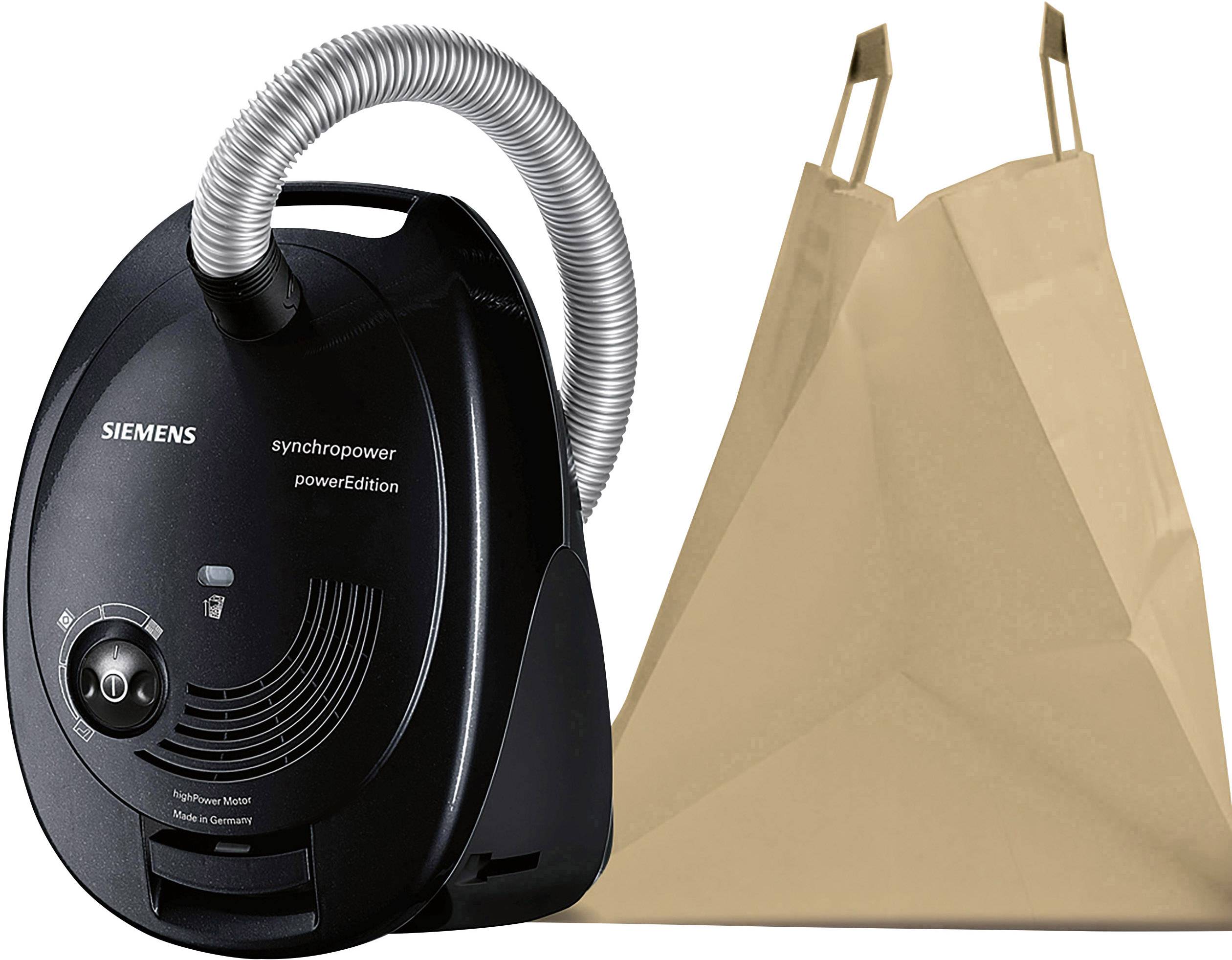 A black Siemens vacuum cleaner with a hose is standing next to a large brown paper bag. The vacuum cleaner displays the 'synchropower' model.