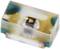 Small electronic component in rectangular shape, likely an SMD LED, with metallic contacts and transparent cover.