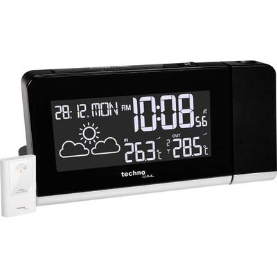 Black digital alarm clock shows date '28.12 Monday', time '10:08', weather with sun and clouds, indoor temperature '26.3°C', outdoor temperature '28.5°C'.