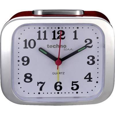 A silver alarm clock shows 10:09.