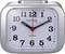 Silver alarm clock with an analogue display, white dial face, Arabic numerals, and red hands, showing 10:10.