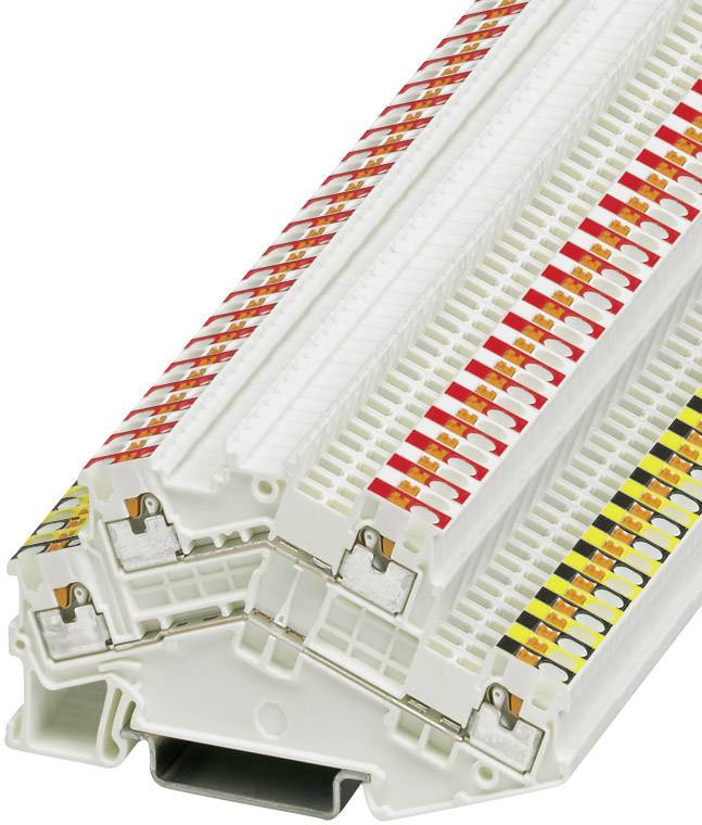 A stack of white patch panels with coloured markings on the top surface, used for cable management in telecommunications systems.