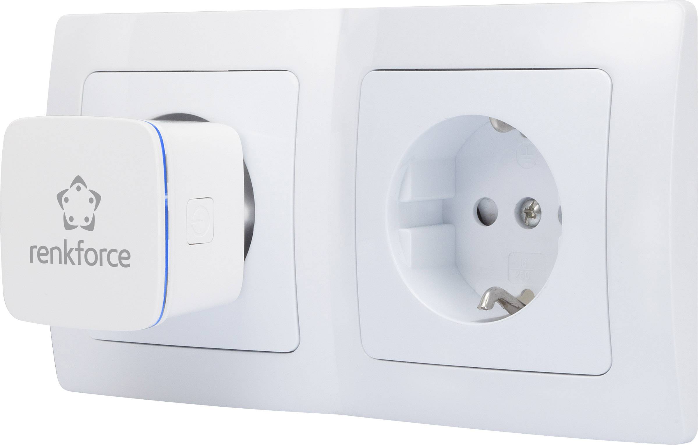 A white double socket, one of which has a 'Renkforce' adapter plugged in. The adapter has a square body.