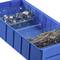 A blue storage box with two compartments: one with metal clips, the other with a collection of screws.
