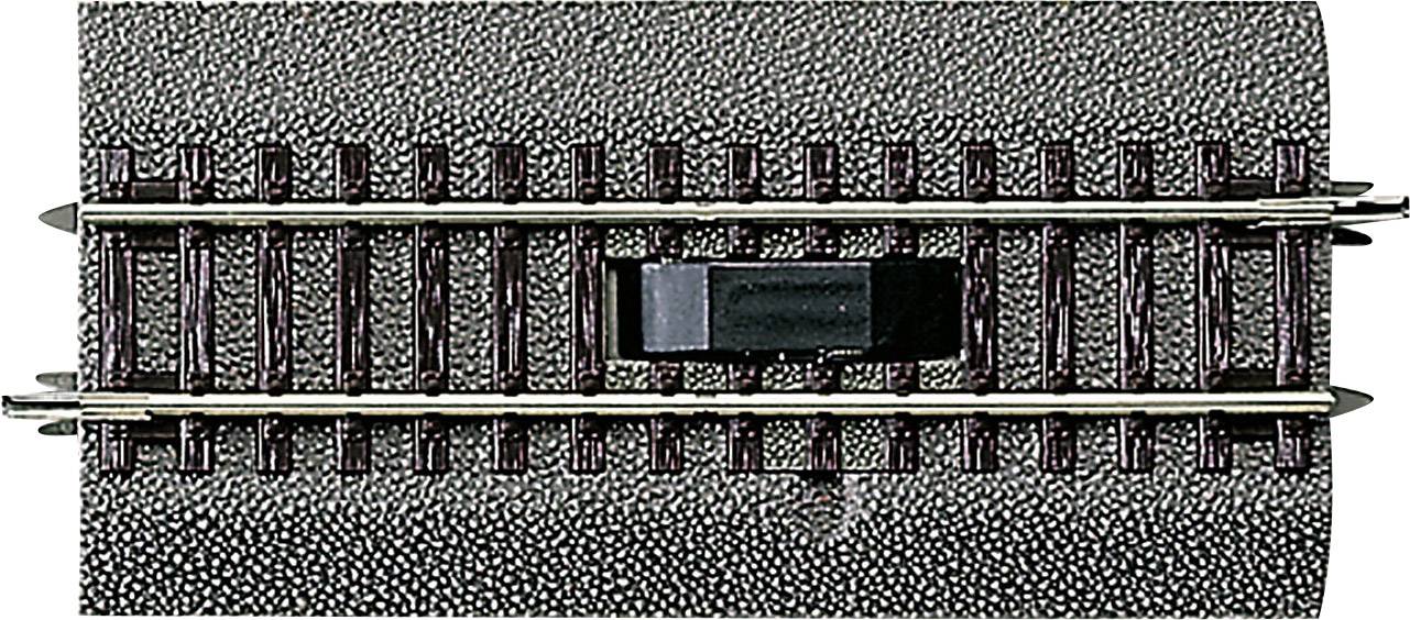 Model railway track section with an integrated switch in the middle to control the electrical current flow.