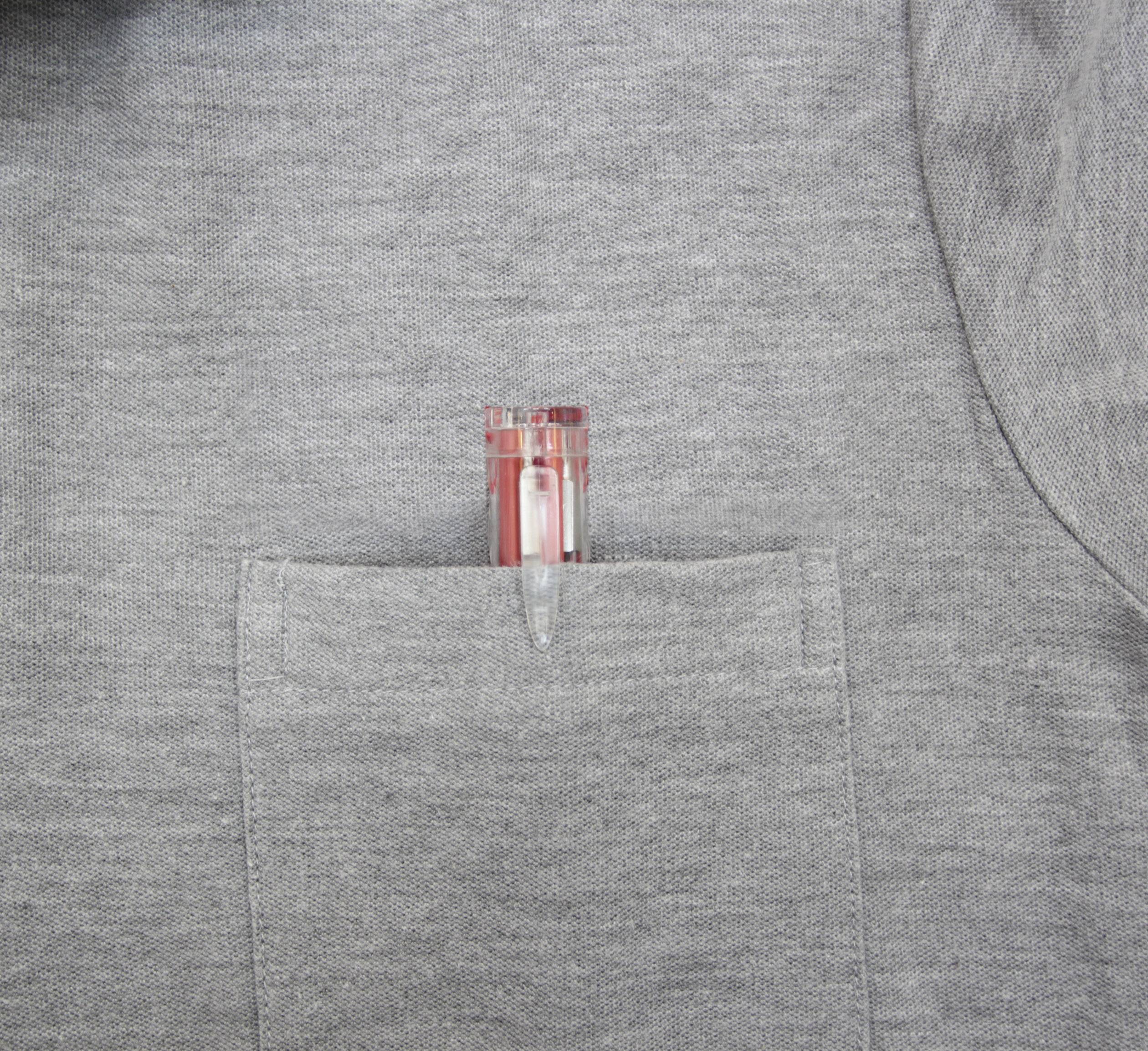 A red ballpoint pen is tucked into the breast pocket of a grey shirt.